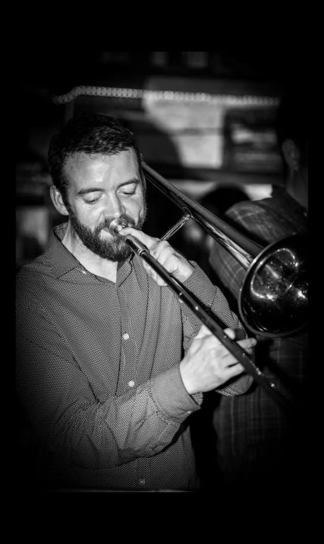 Band leader Eoghan Kelly playing his trombone