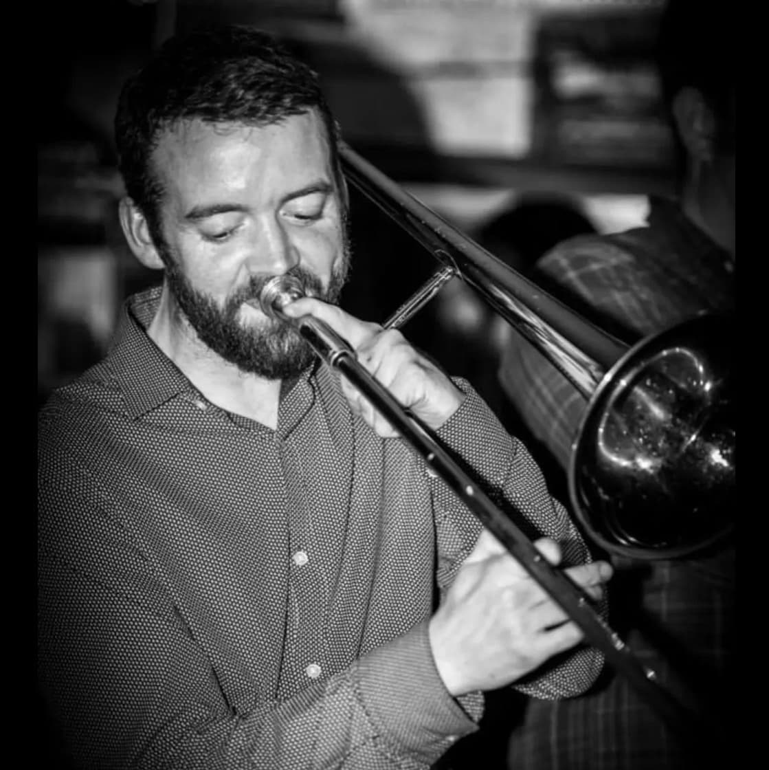 Band leader Eoghan Kelly playing his trombone Band leader Eoghan Kelly playing his trombone